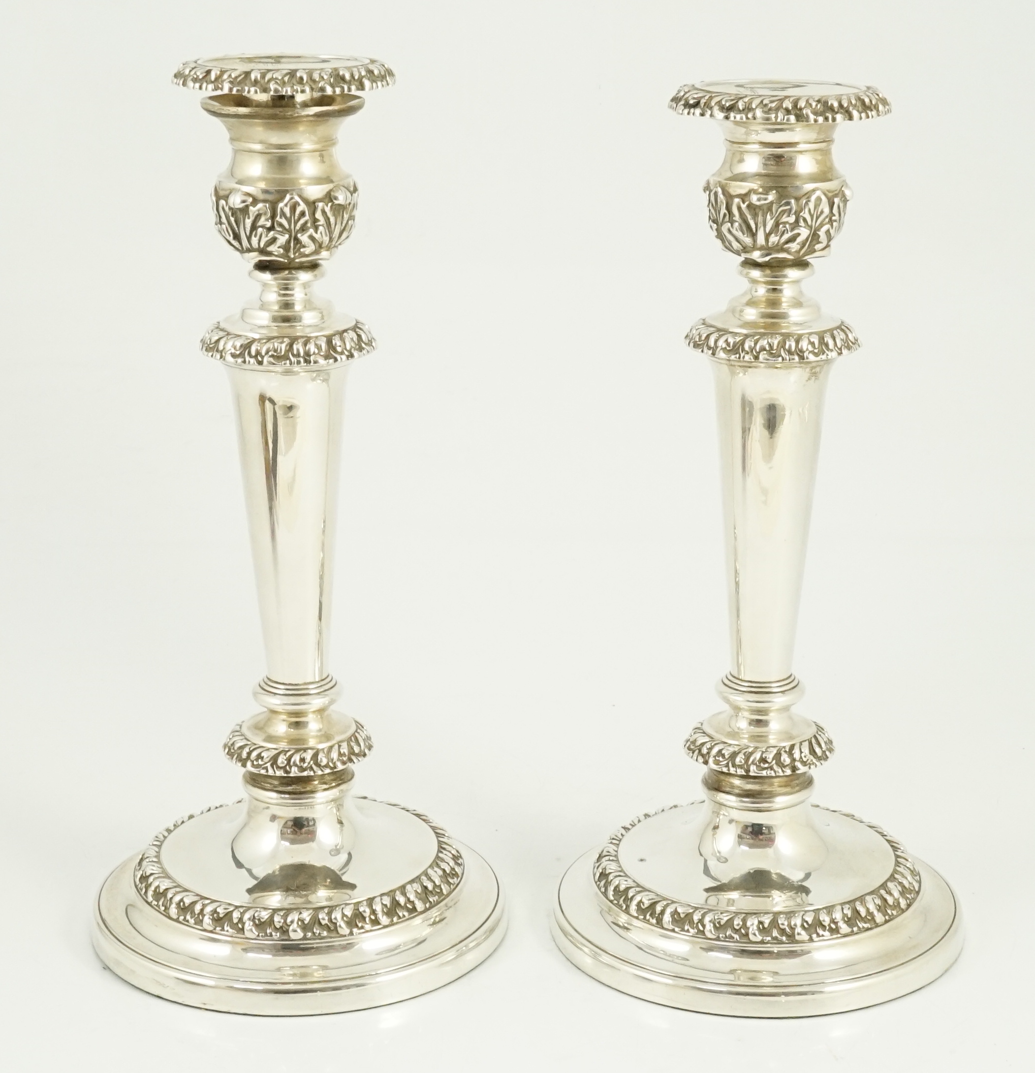 A pair of George III silver candlesticks by John & Thomas Settle